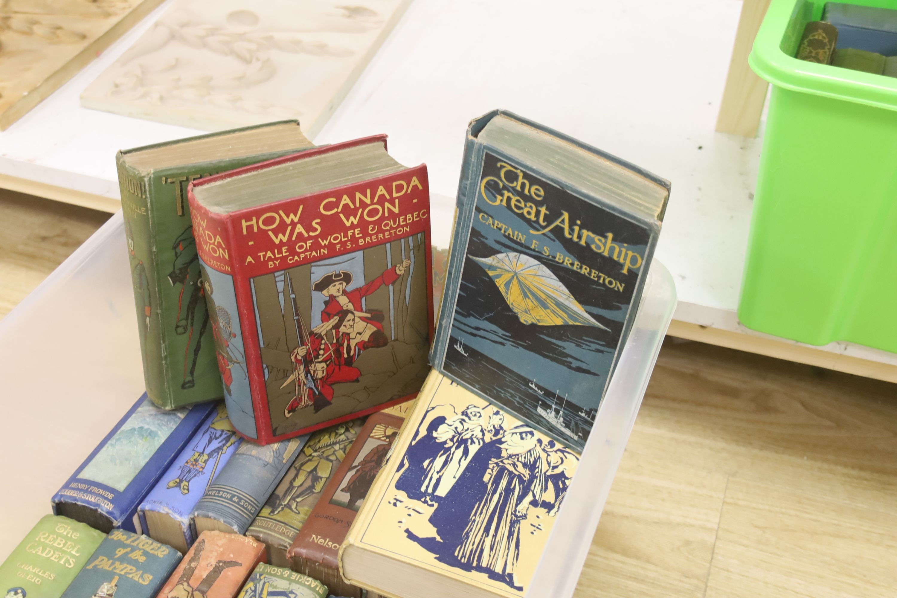 Twenty one early 20th century children's adventure novels, with pictorial covers, published by Blackie and Son Ltd, etc.